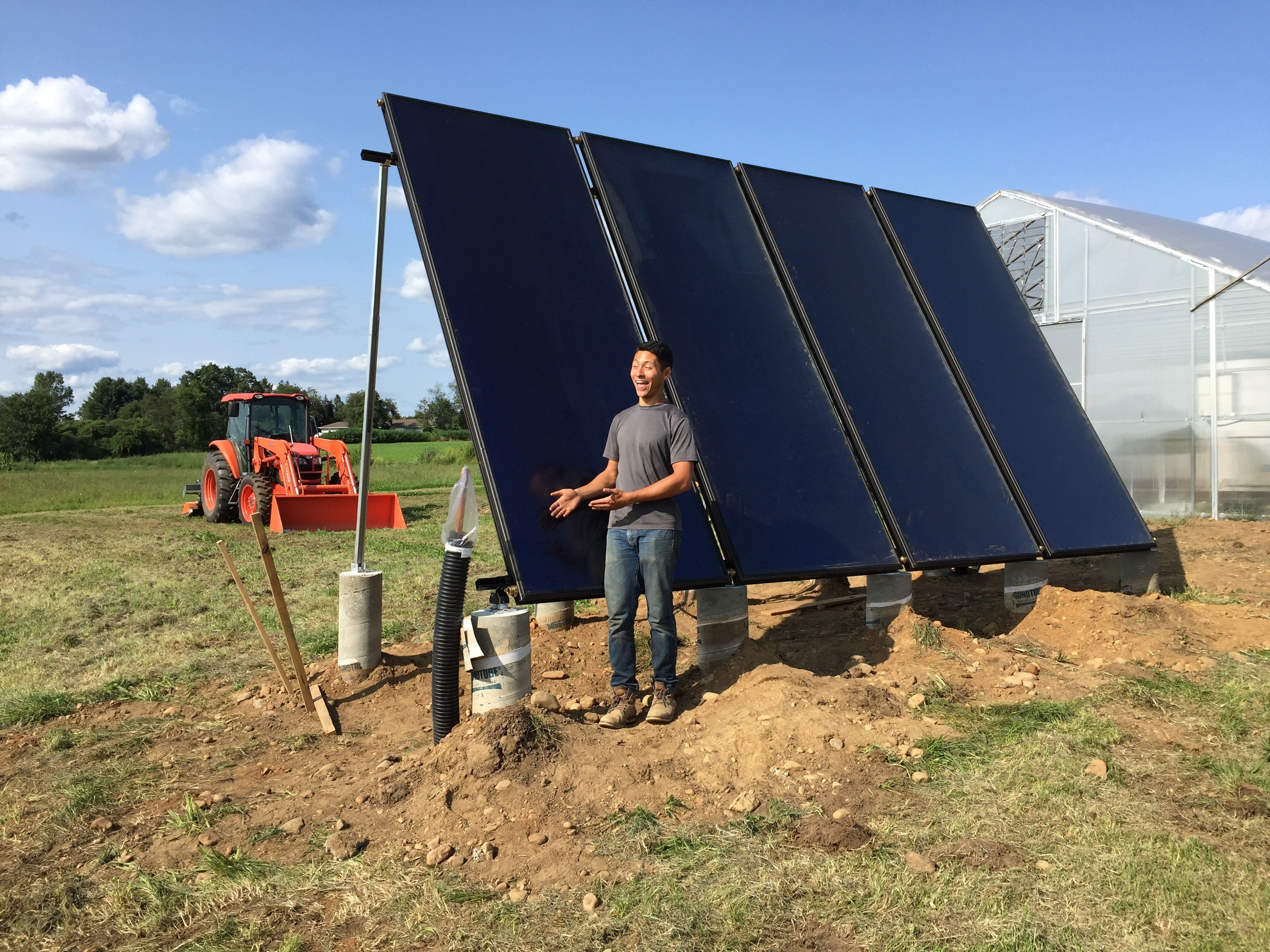Matt Yee with Solar Panel @ UMass Farm
